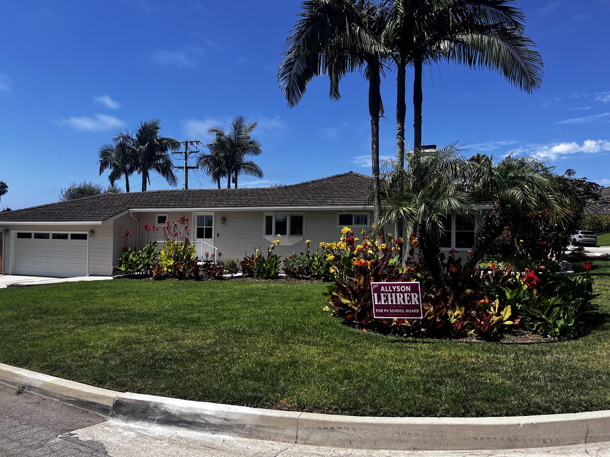 An Allyson Lehrer lawn sign displayed in a front yard