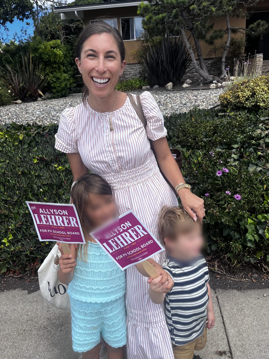 Allyson Lehrer with supporters holding campaign signs